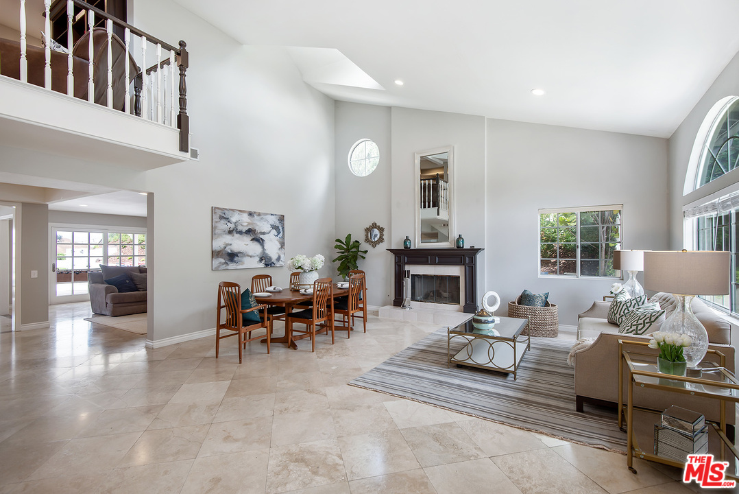 26021 Farmfield Road Calabasas, CA 91302 - Photo 5 of 50 a living room with furniture and a fireplace