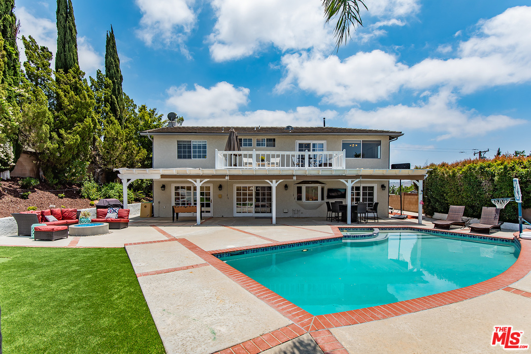 26021 Farmfield Road Calabasas, CA 91302 - Photo 45 of 50 a view of a house with a swimming pool and sitting area