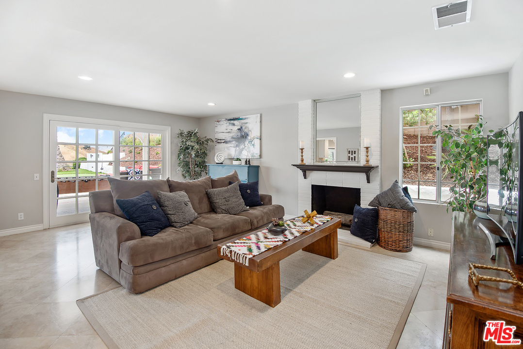 26021 Farmfield Road Calabasas, CA 91302 - Photo 8 of 50 a living room with furniture and a fireplace