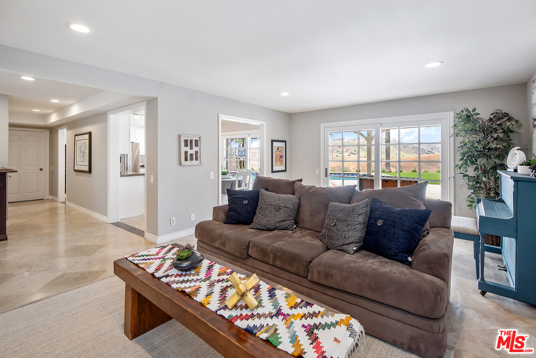 26021 Farmfield Road Calabasas, CA 91302 - Photo 10 of 50 a living room with furniture and a large window