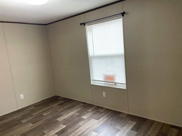 a white toilet sitting next to a bath tub
