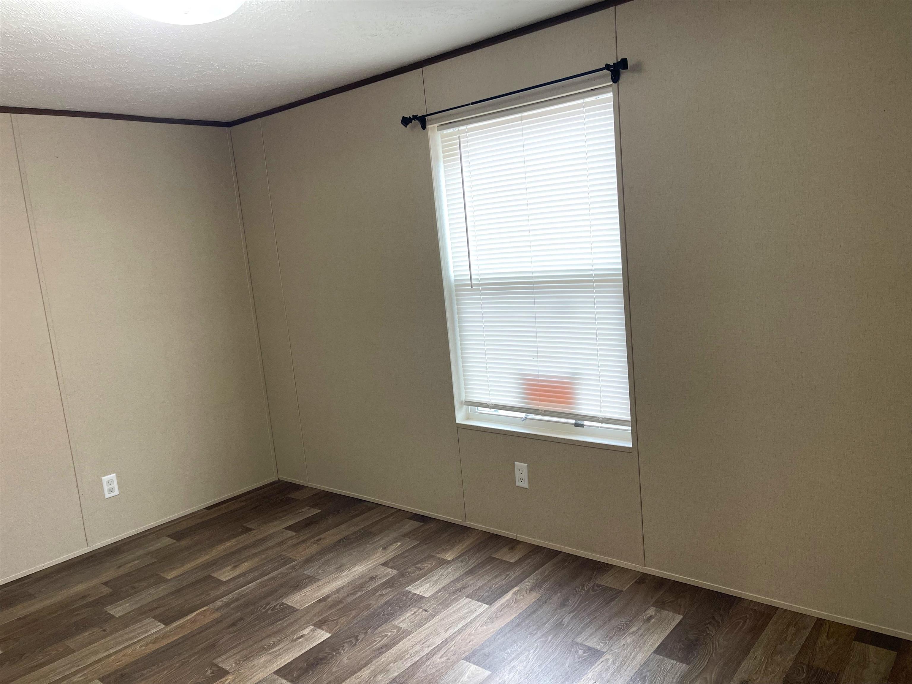 802 East Collins Street Llano, TX 78643 - Photo 8 of 14 a view of an empty room and window