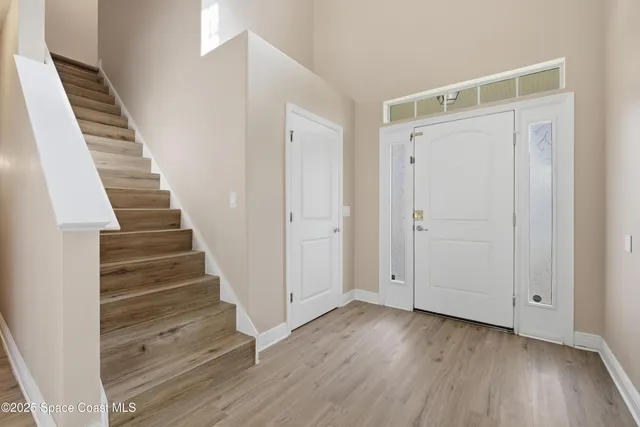 an empty room with wooden floor