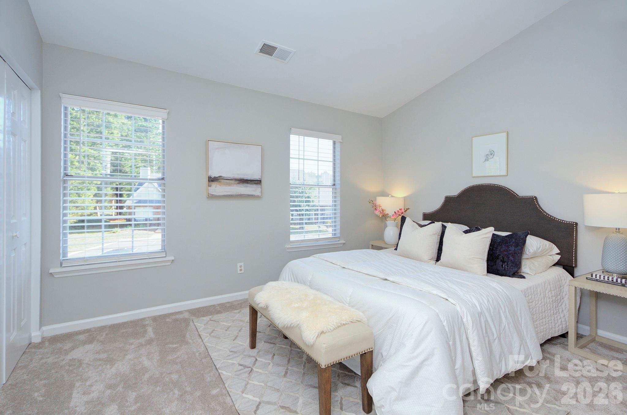 8268 Golf Ridge Drive Charlotte, NC 28277 - Photo 16 of 24 a bedroom with a bed and a window