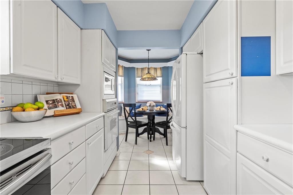 100 Circle Drive Pittsburgh, PA 15237 - Photo 11 of 31 a kitchen with stainless steel appliances granite countertop a refrigerator and a stove top oven