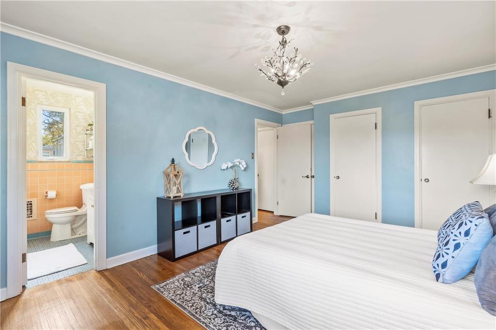 100 Circle Drive Pittsburgh, PA 15237 - Photo 15 of 31 a bedroom with a large bed and a chandelier