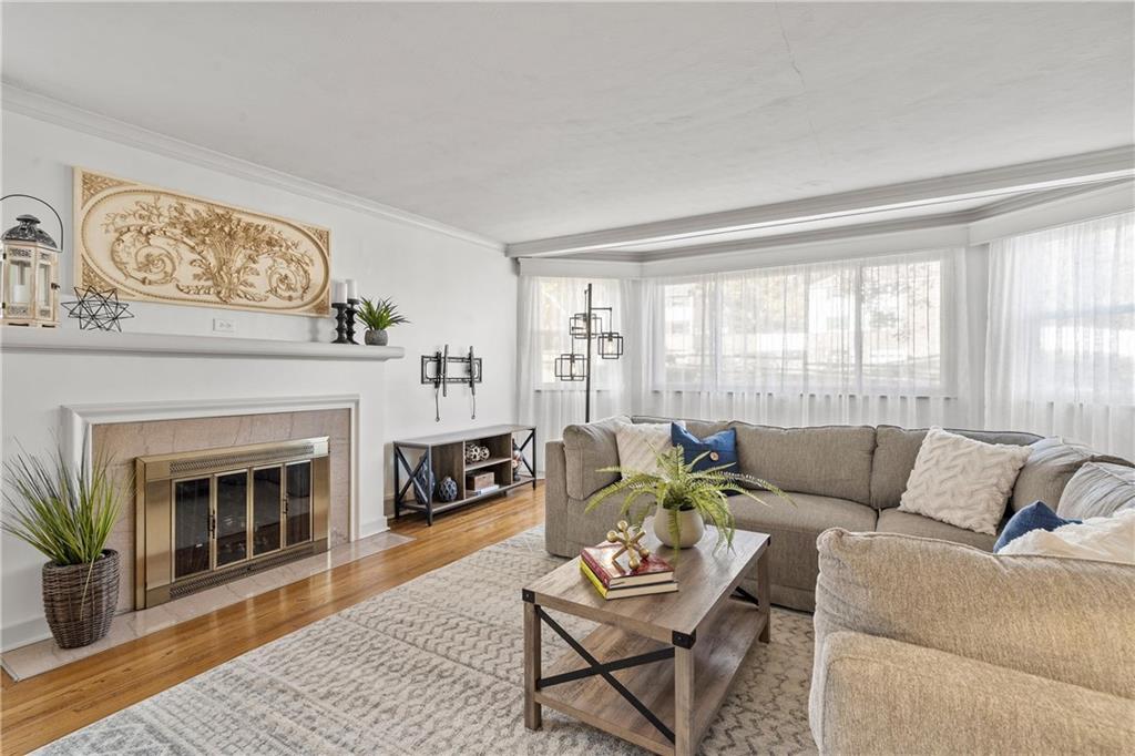 100 Circle Drive Pittsburgh, PA 15237 - Photo 5 of 31 a living room with furniture a window and a fireplace