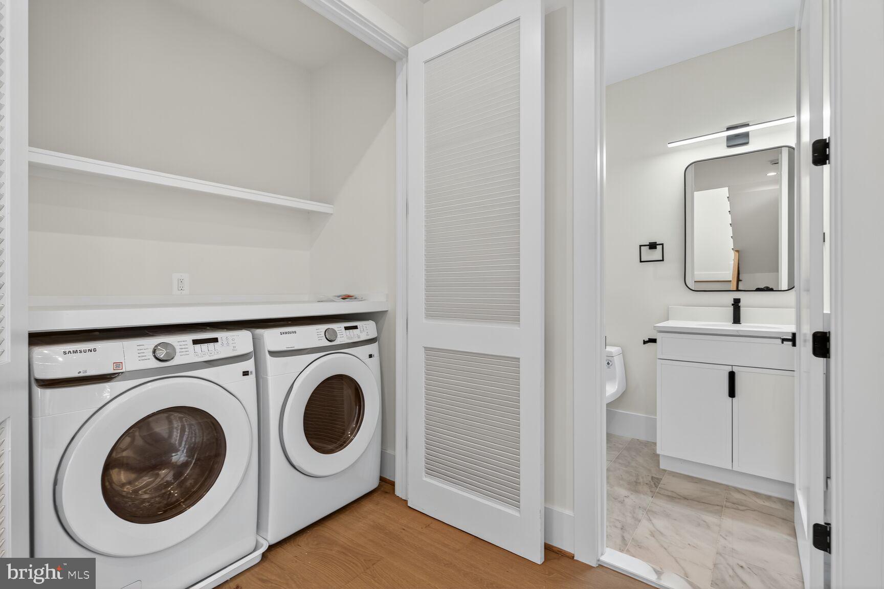 1209 Decatur Street Northwest Washington, DC 20011 - Photo 19 of 54 a utility room with sink dryer and washer