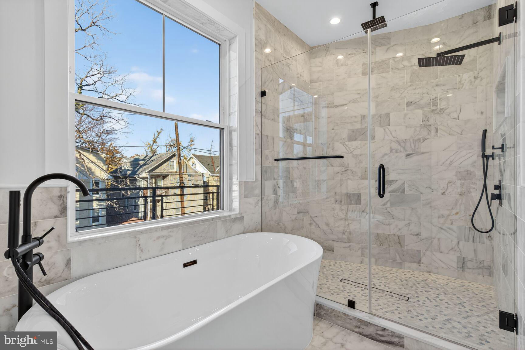 1209 Decatur Street Northwest Washington, DC 20011 - Photo 26 of 54 a bathroom with a bathtub and a shower