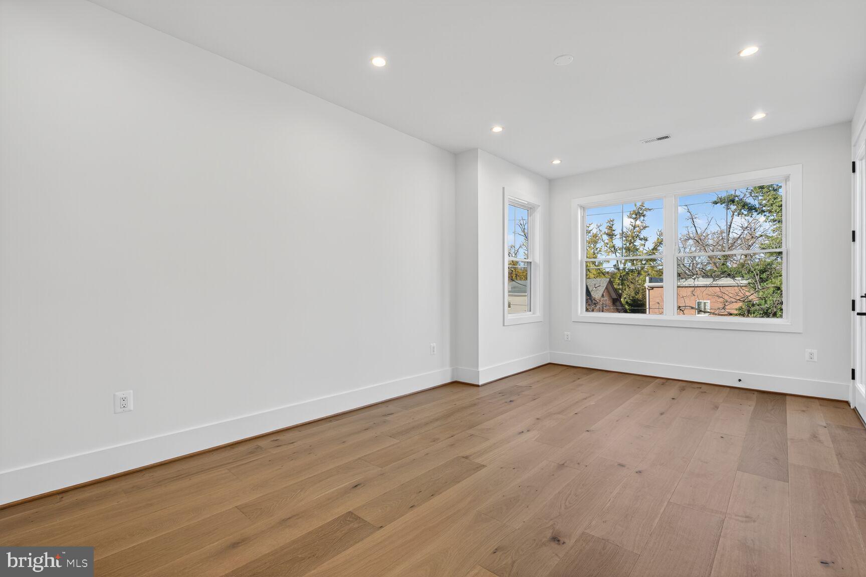 1209 Decatur Street Northwest Washington, DC 20011 - Photo 32 of 54 wooden floor in an empty room with a window