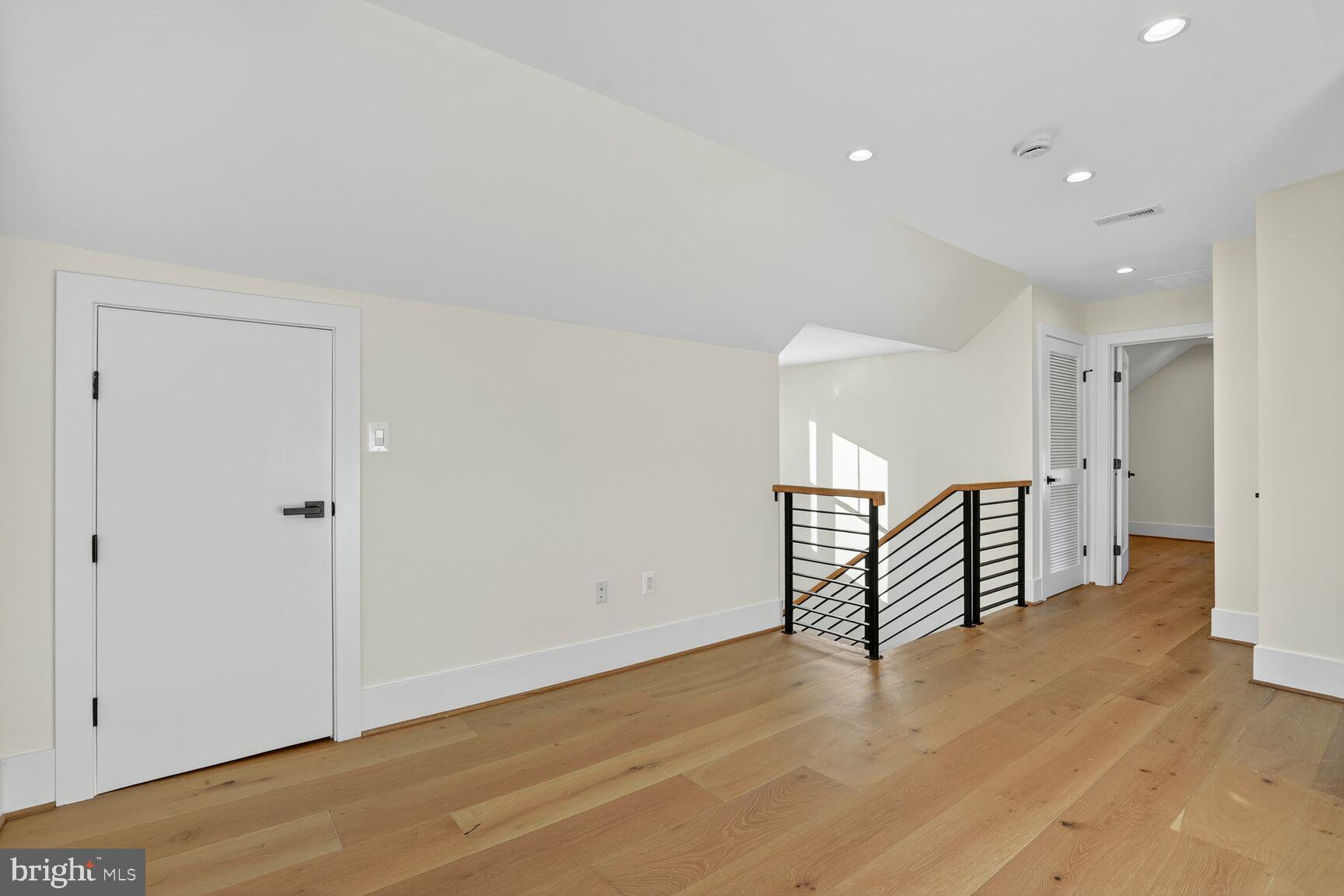 1209 Decatur Street Northwest Washington, DC 20011 - Photo 34 of 54 a view of a room with wooden floor and stairs