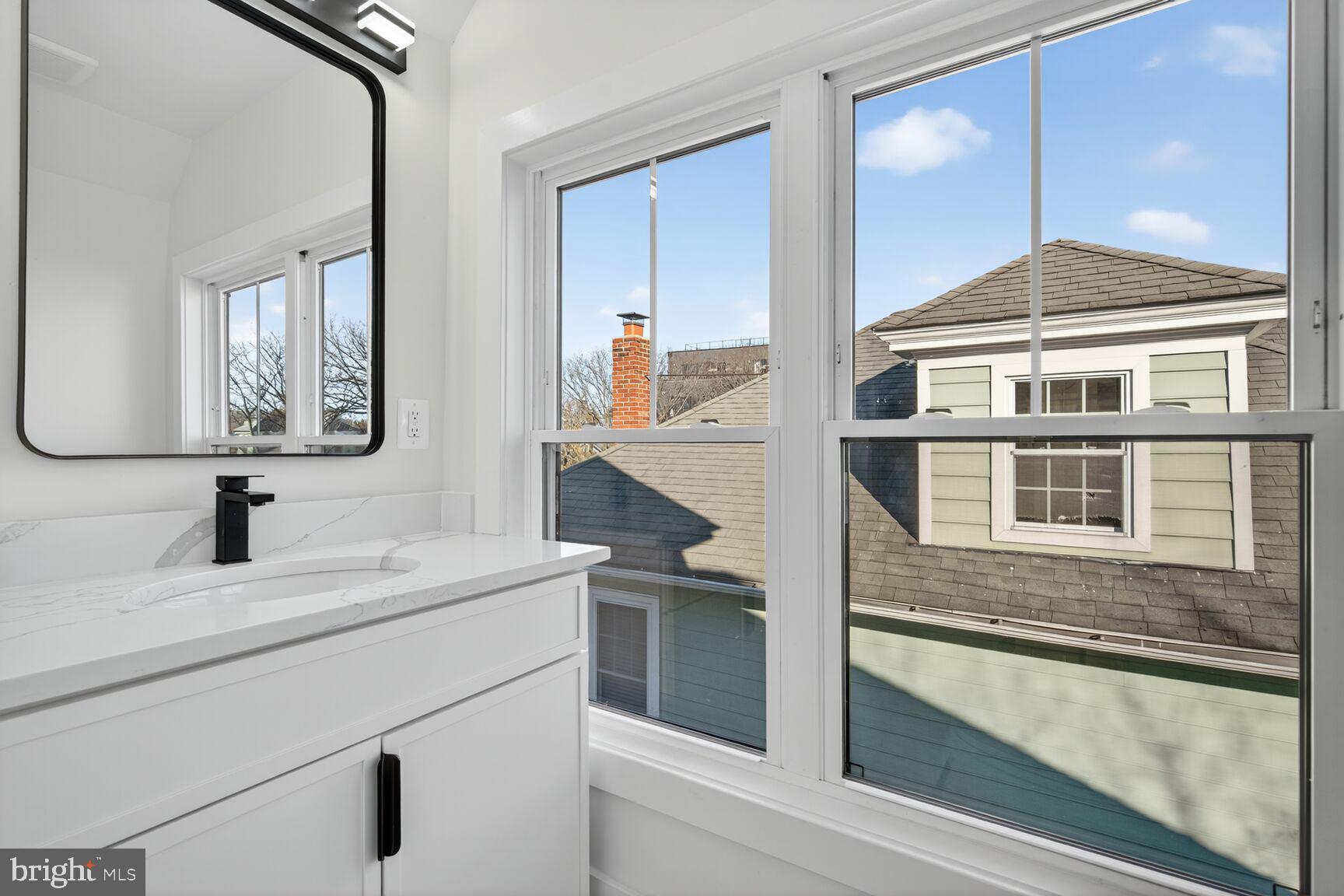 1209 Decatur Street Northwest Washington, DC 20011 - Photo 37 of 54 a bathroom with a sink and a mirror