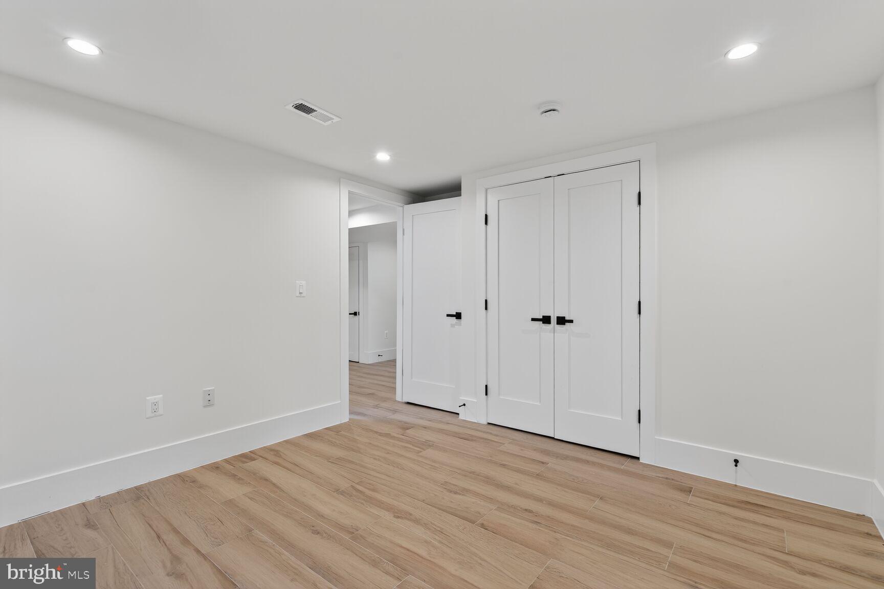 1209 Decatur Street Northwest Washington, DC 20011 - Photo 43 of 54 a view of room with wooden floor
