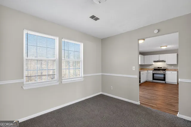 a view of a kitchen with a sink and a window