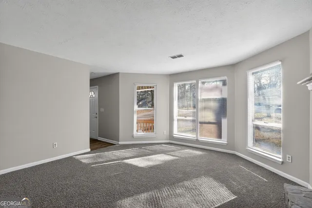 a view of a room with large windows