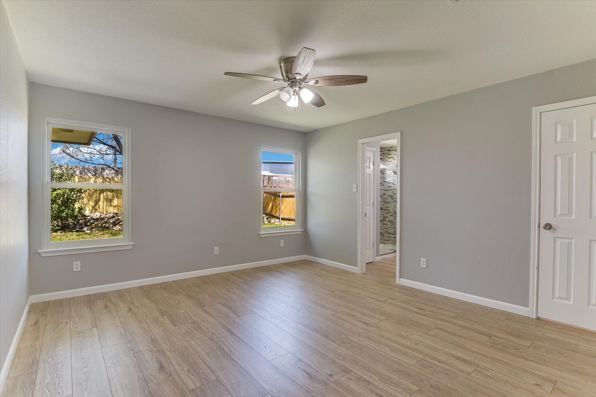 1520 Miss Allison's Way Pflugerville, TX 78660 - Photo 12 of 20 wooden floor in an empty room with a window