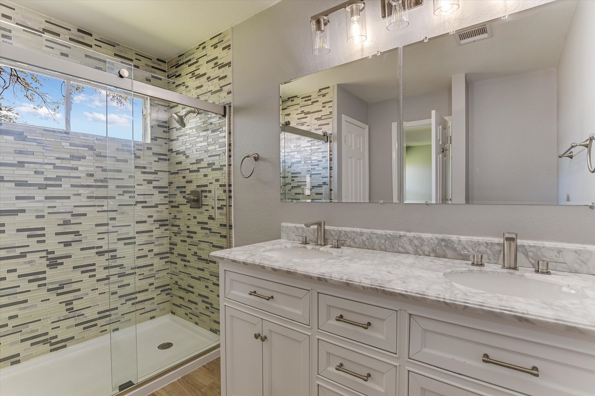 1520 Miss Allison's Way Pflugerville, TX 78660 - Photo 14 of 20 a bathroom with a shower sink and mirror
