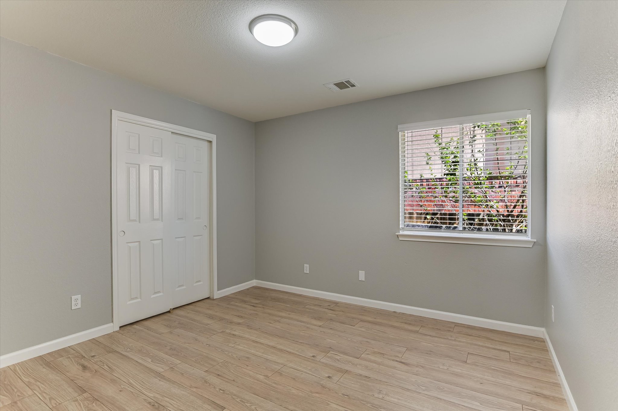 1520 Miss Allison's Way Pflugerville, TX 78660 - Photo 17 of 20 wooden floor in an empty room with a window