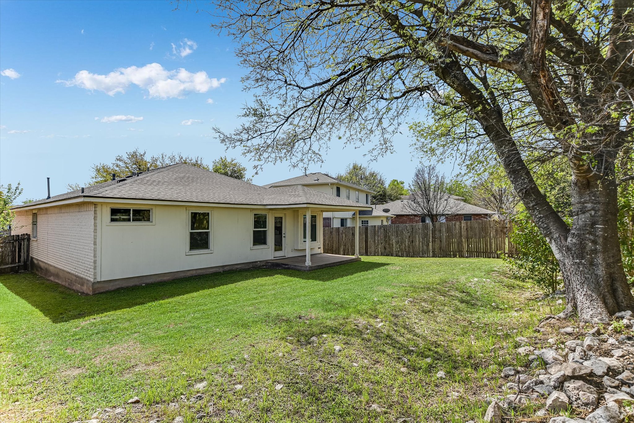 1520 Miss Allison's Way Pflugerville, TX 78660 - Photo 19 of 20 a view of a house with a yard and a large tree