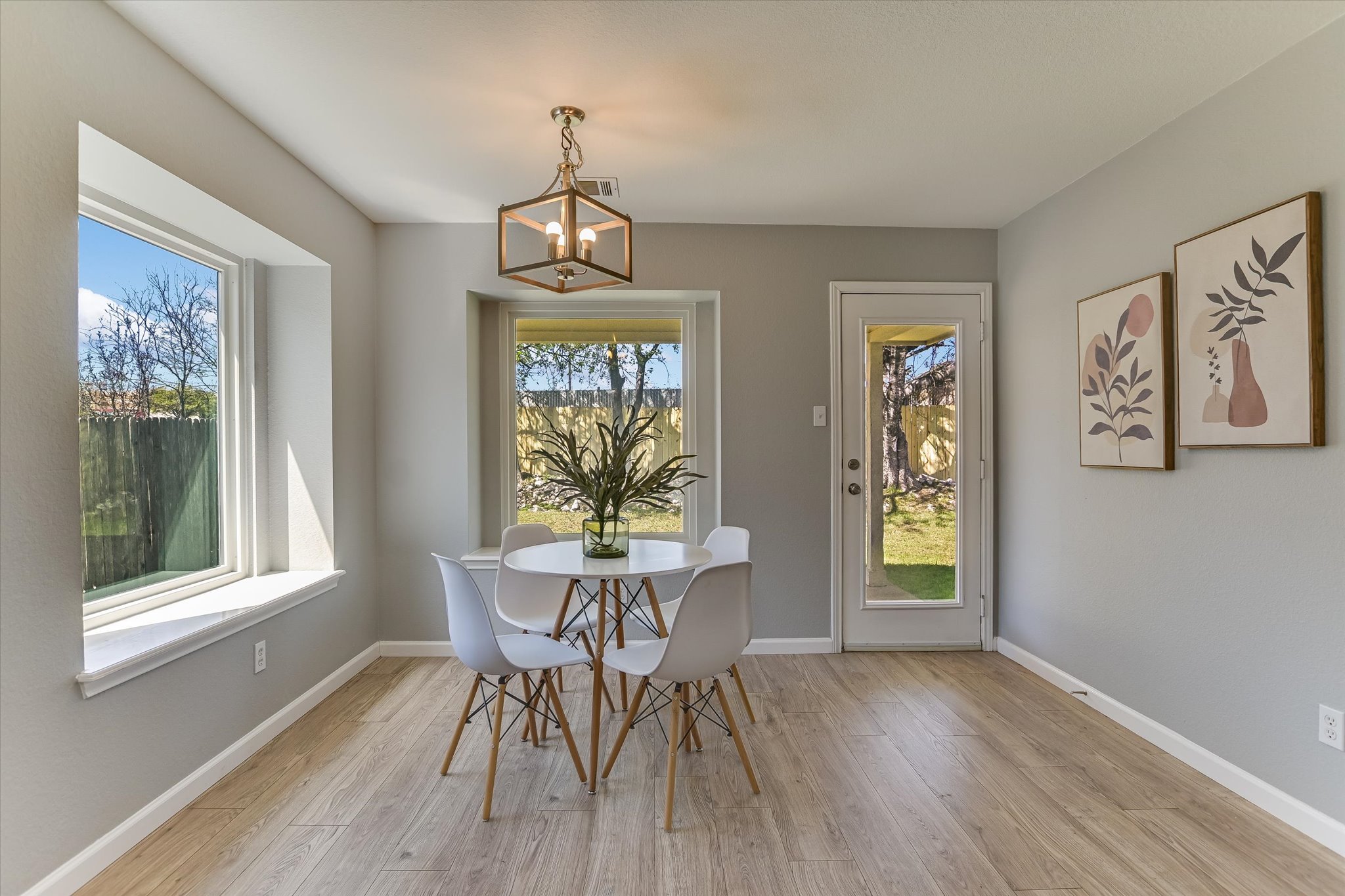 1520 Miss Allison's Way Pflugerville, TX 78660 - Photo 10 of 20 a view of a dining room with furniture window and wooden floor