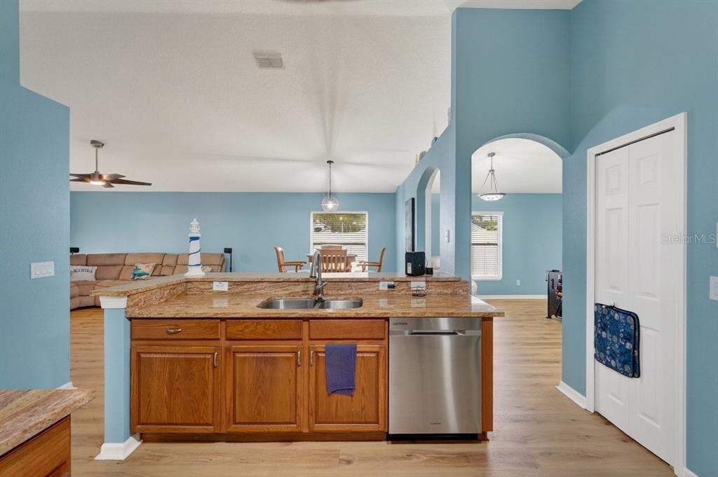 630 Fawn Ridge Drive Orange City, FL 32763 - Photo 15 of 55 a kitchen with stainless steel appliances granite countertop a stove a sink and a refrigerator