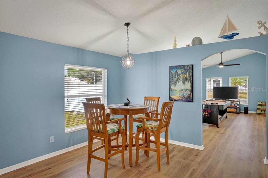 630 Fawn Ridge Drive Orange City, FL 32763 - Photo 19 of 55 a view of a dining room with furniture window and wooden floor