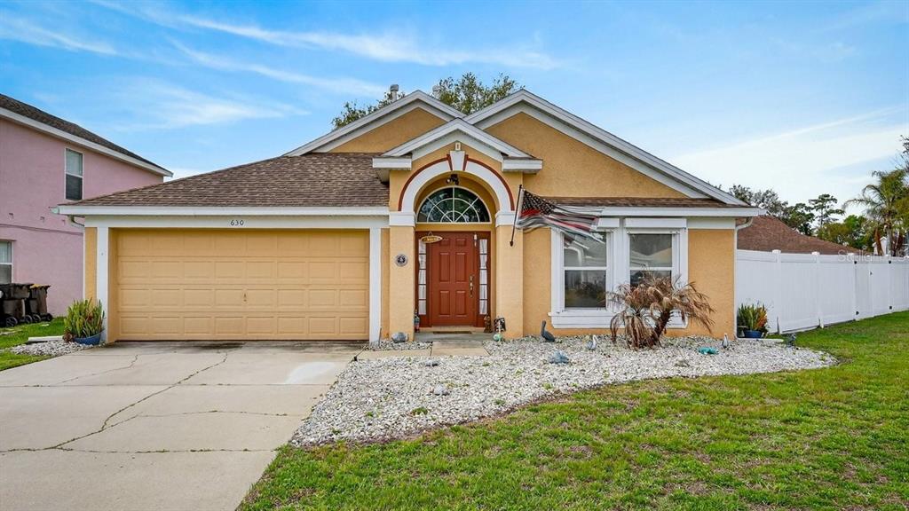 630 Fawn Ridge Drive Orange City, FL 32763 - Photo 2 of 55 a front view of a house with a garden