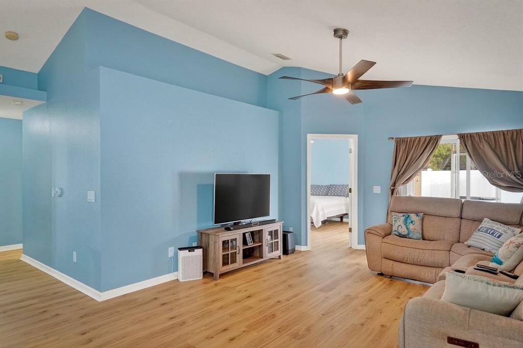 630 Fawn Ridge Drive Orange City, FL 32763 - Photo 24 of 55 a living room with furniture and a flat screen tv