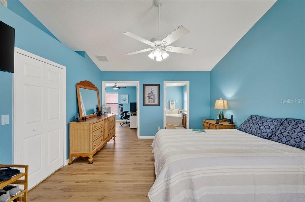 630 Fawn Ridge Drive Orange City, FL 32763 - Photo 28 of 55 a bedroom with a bed wooden floor and ceiling fan