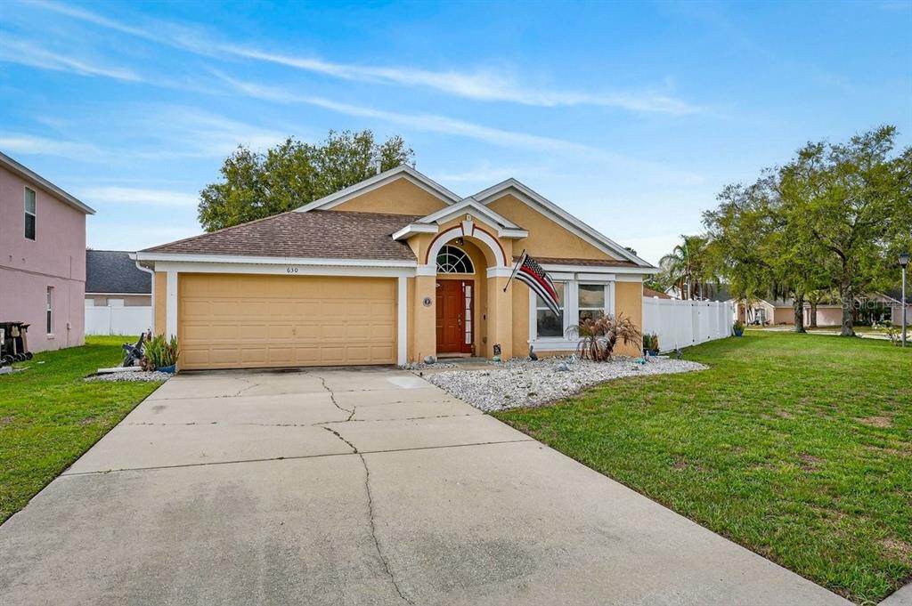 630 Fawn Ridge Drive Orange City, FL 32763 - Photo 3 of 55 a front view of a house with a yard