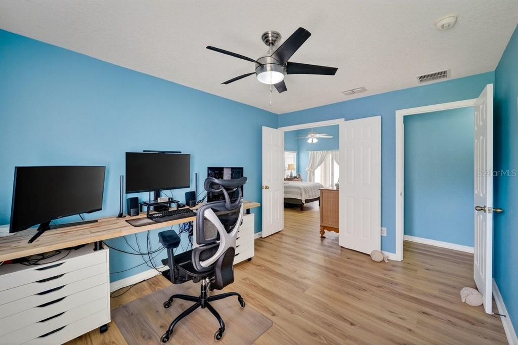 630 Fawn Ridge Drive Orange City, FL 32763 - Photo 35 of 55 a work room with furniture and a flat screen tv