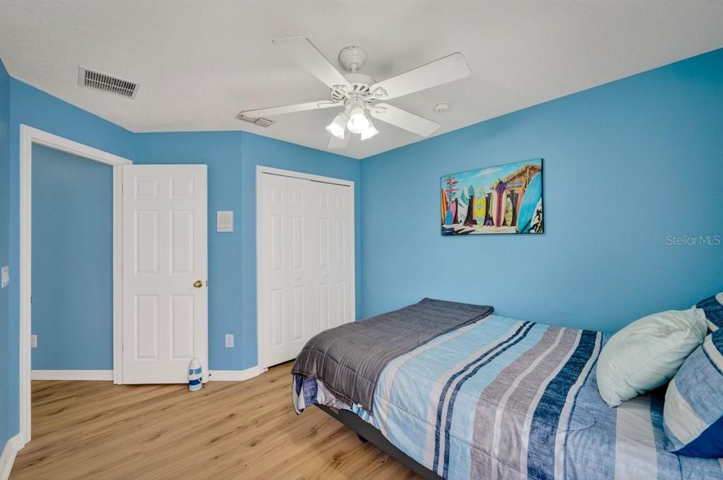 630 Fawn Ridge Drive Orange City, FL 32763 - Photo 37 of 55 a bedroom with a bed and a chandelier