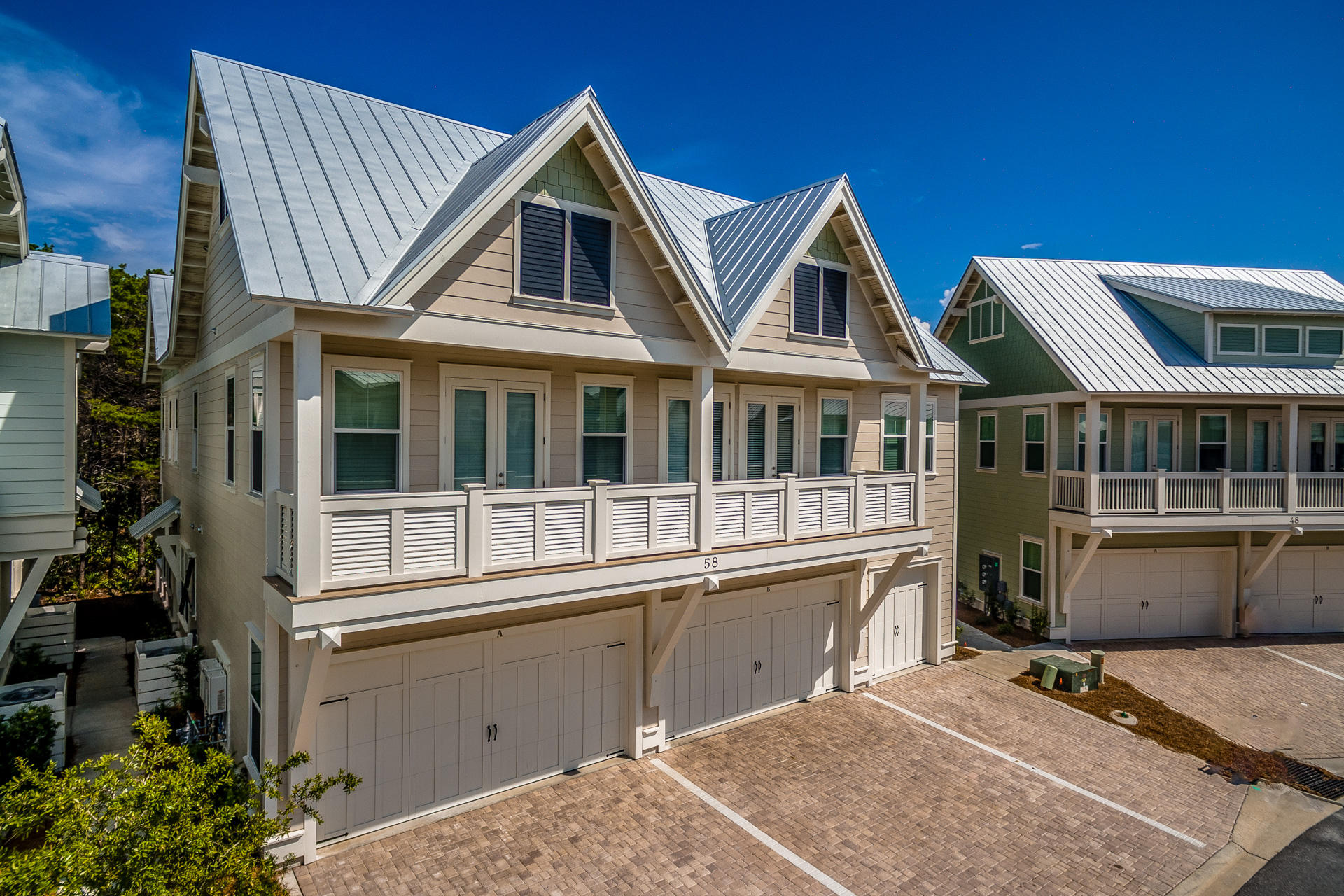 89 East Pine Lands Loop, Unit A Inlet Beach, FL 32461 - Photo 1 of 40 a front view of a house with a yard