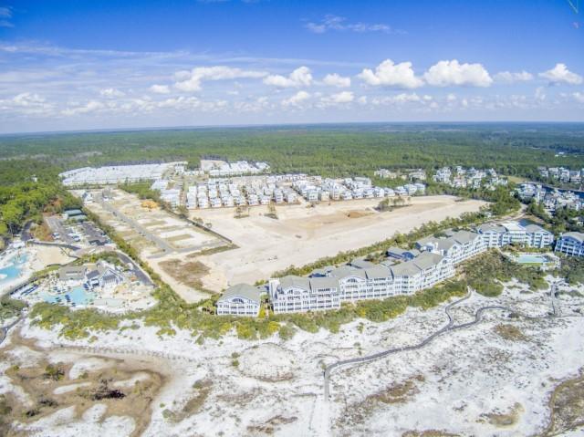 89 East Pine Lands Loop, Unit A Inlet Beach, FL 32461 - Photo 15 of 40 a view of a lake with a beach