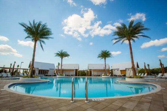 89 East Pine Lands Loop, Unit A Inlet Beach, FL 32461 - Photo 21 of 40 a view of a swimming pool with a table and chair
