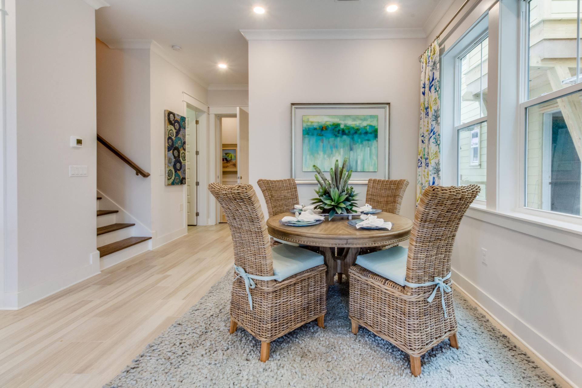 89 East Pine Lands Loop, Unit A Inlet Beach, FL 32461 - Photo 4 of 40 a view of a dining room with furniture window and wooden floor