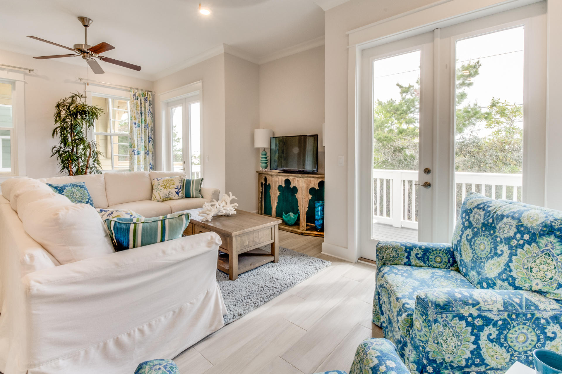 89 East Pine Lands Loop, Unit A Inlet Beach, FL 32461 - Photo 6 of 40 a living room with furniture and a large window