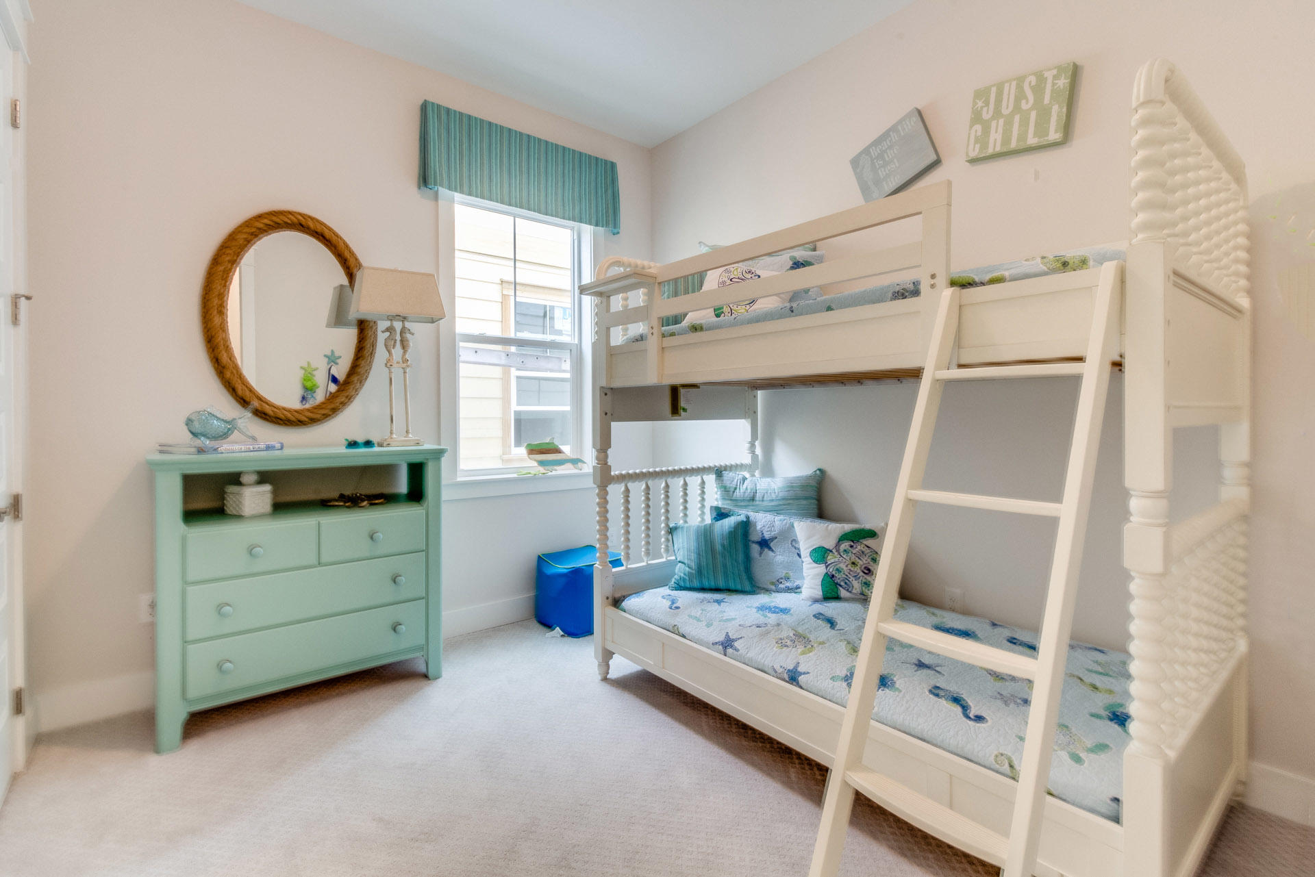 89 East Pine Lands Loop, Unit A Inlet Beach, FL 32461 - Photo 9 of 40 a room with a bunk bed and a dresser