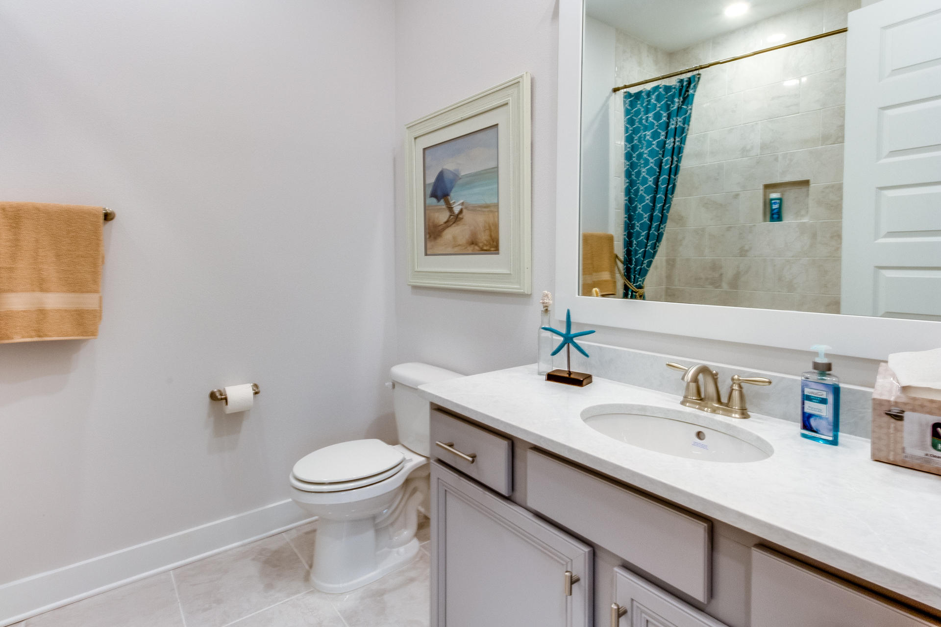 89 East Pine Lands Loop, Unit A Inlet Beach, FL 32461 - Photo 10 of 40 a bathroom with a sink a toilet and a mirror