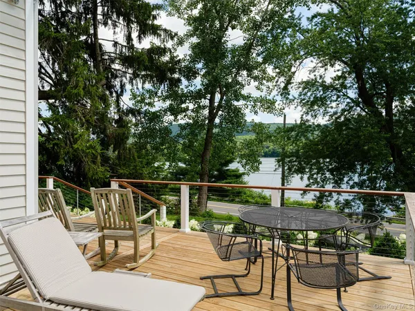a view of a lake with a floor to ceiling window