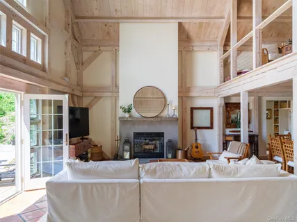 a living room with fireplace furniture and a fireplace