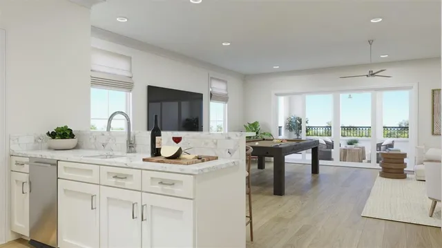 a kitchen with sink and white cabinets