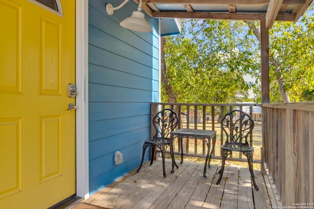 a view of a chair and table in the balcony