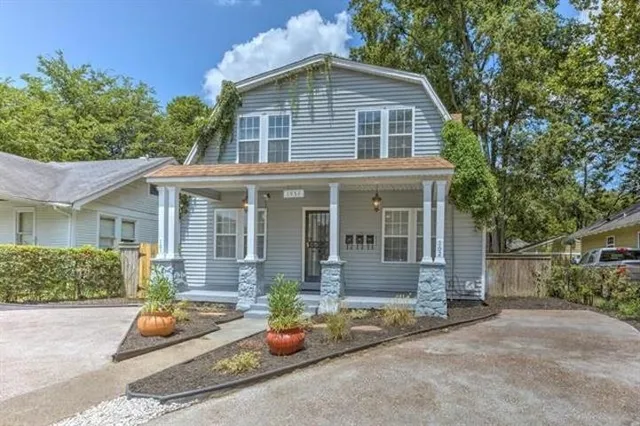 front view of a house with a yard