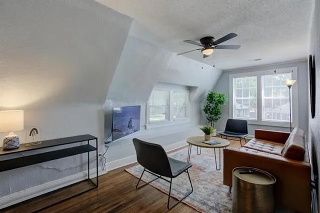 a work room with furniture and a window
