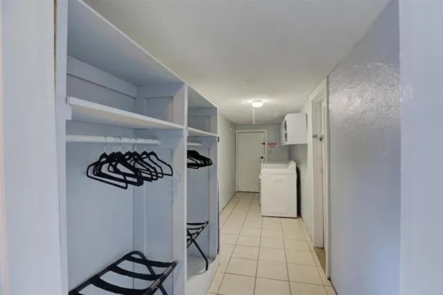 a view of a storage & utility room with washer and dryer