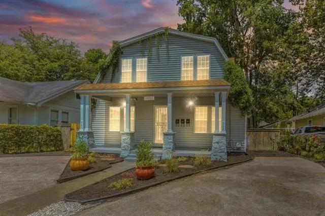 front view of a house with a yard