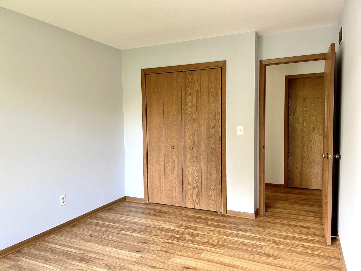 1277 Getzelman Drive Elgin, IL 60123 - Photo 15 of 20 a view of an empty room with wooden floor and closet