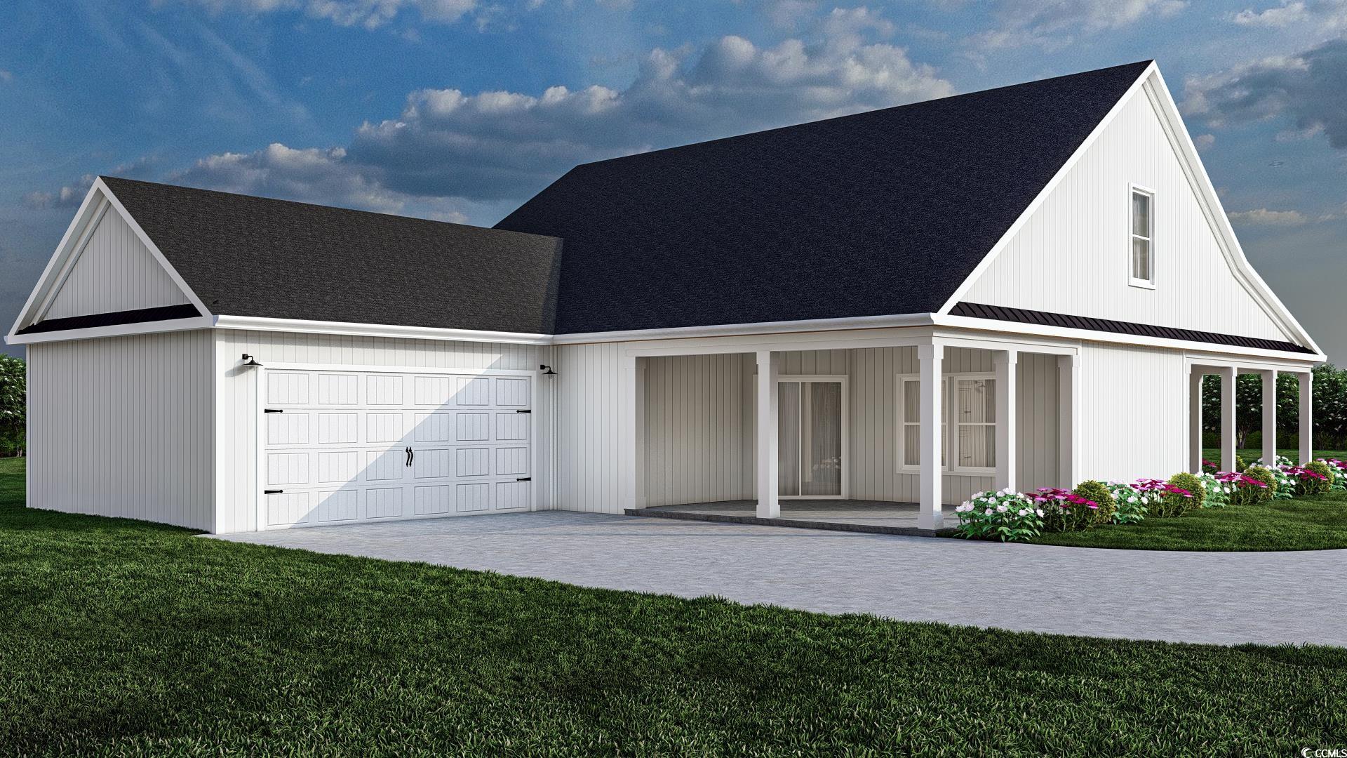 2220 Pettus Way Surfside Beach, SC 29575 - Photo 8 of 9 View of front facade with a porch, a garage, and a rear lawn