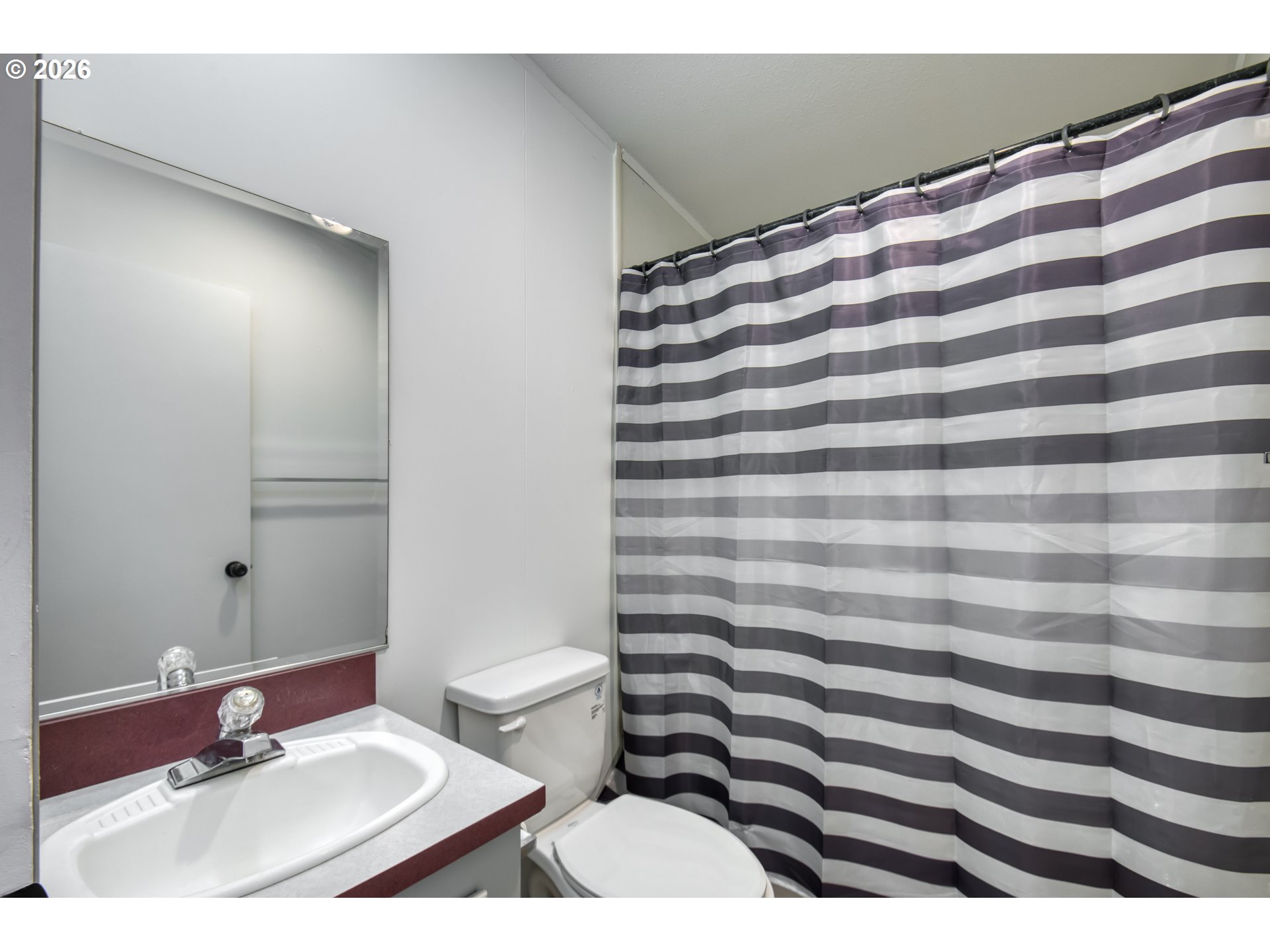 513 Rose Avenue Vernonia, OR 97064 - Photo 15 of 19 a bathroom with a sink and a mirror